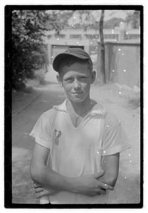 A boy with an medal pinned on his shirt