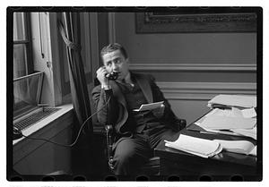 A man seated at a desk