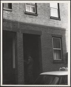 Letter carrier delivering mail, Johnny Ct., Chinatown, Boston