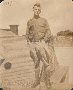 Albert T. Chase in uniform standing on roof, possibly West Yarmouth, Mass.