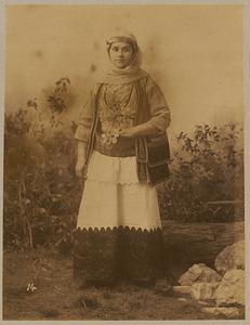 Studio portrait of woman in traditional Greek dress