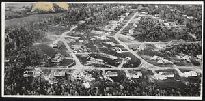 Shrewsbury Homes Wrecked - These Shrewsbury homes in the path of the tornado were blown apart like toy houses. Homes in the center of the photograph were leveled. They were struck by the full force of the twister. Specks of debris may be seen dotting the area.