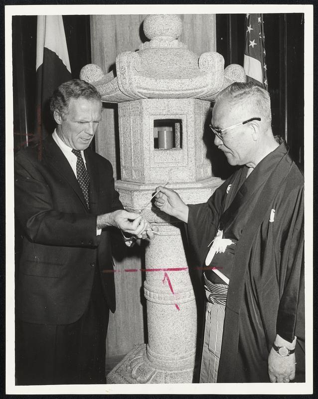 Lighting Way to international friendship are Boston Mayor Kevin H. White and Mayor Kyoshi Tomii of Hub's sister city, Kyoto, Japan, dedicating Japanese stone lanterns at City Hall.