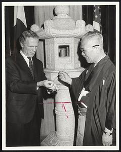 Lighting Way to international friendship are Boston Mayor Kevin H. White and Mayor Kyoshi Tomii of Hub's sister city, Kyoto, Japan, dedicating Japanese stone lanterns at City Hall.