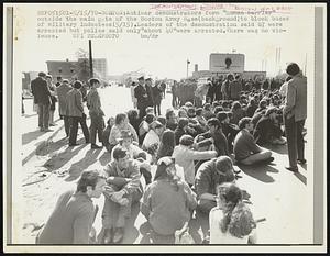 Boston: Antiwar demonstrators form "human barrier" outside the main gate of the Boston Army Base (background) to block buses of Military inductees (5/15), Leaders if the demonstration said 67 were arrested but police said only "about 40" were arrested. There was no violence.