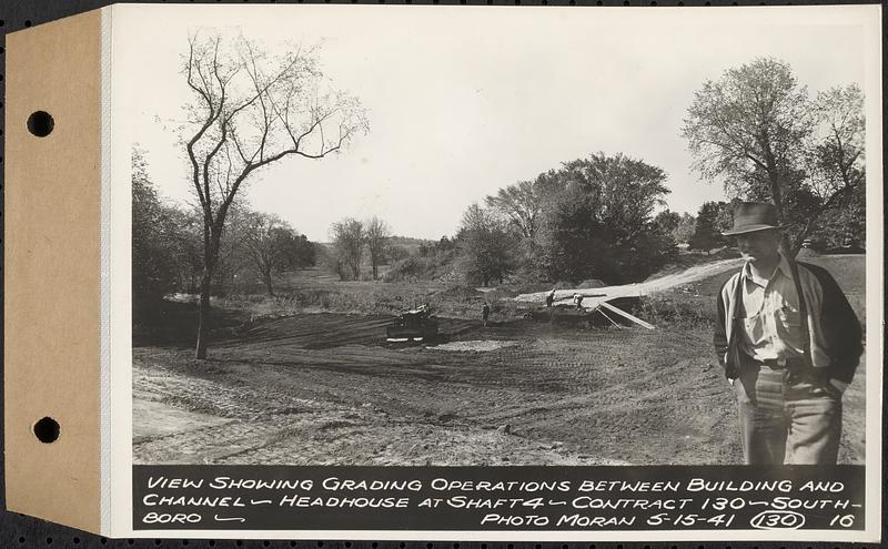 Contract No. 130, Grading, Loaming, and Grassing Vicinity of Shaft 4, Pressure Aqueduct, Southborough, and Improvement of Access Roads to the Intake Works and at Norumbega Reservoir, Marlborough, Southborough, Weston, view showing grading operations between building and channel, headhouse at Shaft 4, Southborough, Mass., May 15, 1941