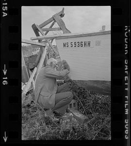 Charlie Powers working on boat