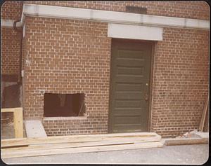 Lawrence Library exterior service doorway with new cut in brick wall