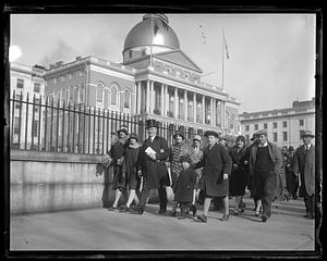 Governor Alvan Fuller leads a group past the State House