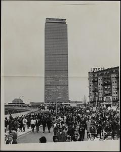 Marchers on Huntington Avenue pass the Prudential Center on the way to the Freedom Rally on Boston Common