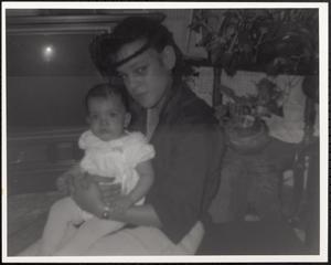 Priscilla Preston holding a baby