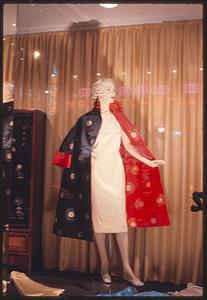 Mannequin in shop window wearing robe