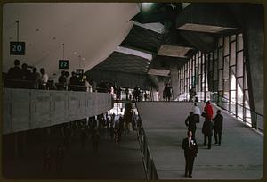 People walking and lining up in Washington State Coliseum, Seattle