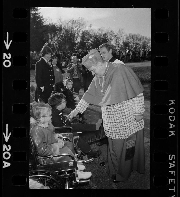 Cardinal Medeiros greets crippled children, Brighton