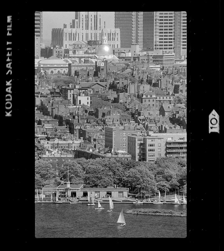 Sailboats on Charles River Basin with Beacon Hill in background, downtown Boston