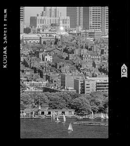 Sailboats on Charles River Basin with Beacon Hill in background, downtown Boston