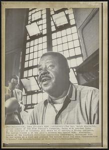 Jail News Conference - The Rev. Ralph Abernathy, jailed leader of the Poor People's Campaign, talks with newsmen today at the District of Columbia jail where he is serving a 20-day sentence. The barred window's of the jail's rotunda are behind him. Abernathy, leader of the Southern Christian Leadership Conference, announced that he was going on a fast and pledged the nation would see more "Resurrection Cityies."