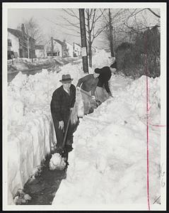 Belmont Digs Out-Fathers shoveling pathway on sidewalk on Cross street, Belmont, so children will not have to walk in the street on way to school. Front to rear, Raymond Cobuzzi, Terry Reilly and Ralph M. Hanrahan.