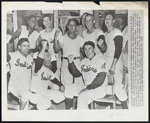 Jubilation in the Wigman--Cleveland Indians manager Al Lopez (seated) joins with some of the team in a cheer after they defeated the Philadelphia A's 5-3 to go ahead of the New York Yankees by five and one-half games. L to R front, Riggie Regalado, Bob Lemon, Lopez. Back Row L to R, Al Smith, Bill Glyn, Bobby Avila, Bob Feller, Al Rosen and Catcher Hal Naragon. The winning run was walked across in the eleventh inning.