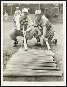 Heavy Hitters Look Over War Clubs. These heavy hitters of the St. Louis Cardinals, John Mize (left) and Enos Slaughter, outfielders, look over the row of bats as the club trained at St. Petersburg, Fla., March 20.