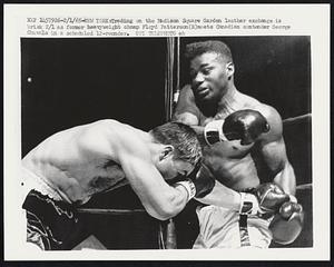 Trading on the Madison Square Garden leather exchange is brisk 2/1 as former heavyweight champ Floyd Patterson (R) meets Canadian contender George Chuvalo in a scheduled 12-rounder.
