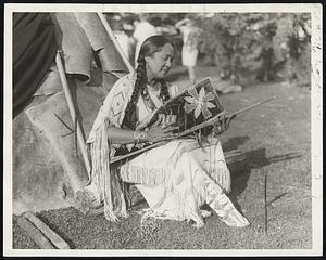 Maine Indians in Ceremonial for First Time. Combining for their first inter-tribal ceremony, braves and their Squaws from the Penobscot and Passamaquoddy tribes of Indians in Maine gathered on one of their ancient hunting grounds on bank of the Penobscot River at Bangor, Maine, and went through ceremonies of centuries ago. Above is shown princess Wavawaso who did an Indian cradle dance.