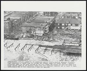 No Boardwalk Walking Today - Part of Atlantic City, N.J., famed boardwalk is ripped from its pilings and thrown, along with other debris, against ocean front homes in the inlet section of the city today. The resort was hard hit along with other coastal towns by the Atlantic storm that left thousands homeless and at least 40 dead.
