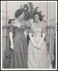 Mother and daughter receiving their guests at a coming-out party at the Longwood Cricket Club are Mrs. Wallace Lincoln Pierce of Chestnut Hill and her debutante daughter, Mary Markle Pierce.