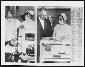 Baby Born By Caesarean Section to Iron Lung Polio Victim-- Mrs. Lucille Hughes, 38, Elmore, Minn., smiles from here iron lung in the Elizabeth Kenny Institute today shortly after a five-pound girl ( in incubator, right) was delivered by Caesarean section. Mrs. Hughes was stricken Sept. 4 with spinal bulbar polio and was hospitalized here through the National Foundation for Infantile Paralysis. Her husband, James, is shown in both picture. The nurse at left is Effie Schmidt. The nurse at right is Madeline Logghe, superintendent of the premature nursery at St. Mary's hospital, where the child was transferred.