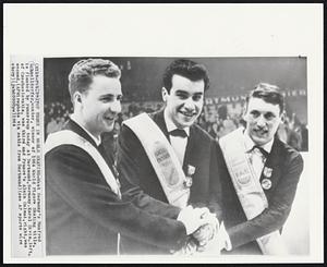 Top Three in World Skating - West Germany's Manfred Schnelldorfer, center, winner of 1964 World Figure Skating title, is flanked by runnersup today at Dortmund, Germany. Karol Divin, left, of Czechoslovakia, was third and France's Alain Calmat, right, was second.