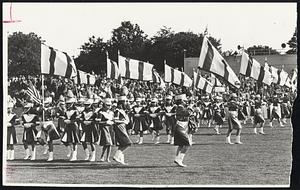 Stepping Smartly, St. Francis Xavier drill team passes packed stands at Legion Field, Weymouth.