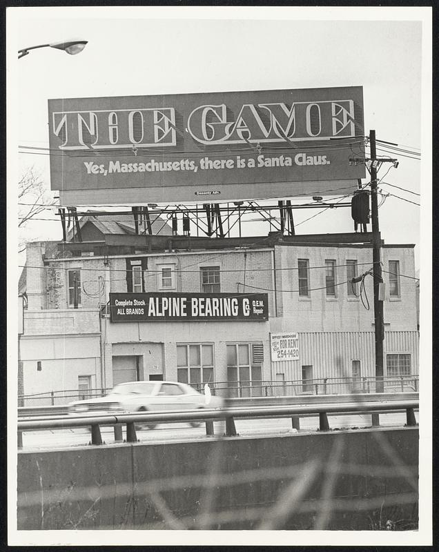 Massachusetts Lottery "Teaser" appears on billboard at Allston entrance to Turnpike.