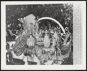 Babylon Parade -- Sargon, king of the Knights of Babylon, waves to the crowd as his float stops in front of the reviewing stand at City Hall to toast his queen and her court in the parade tonight.