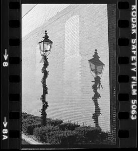 Street lamp outside brick building