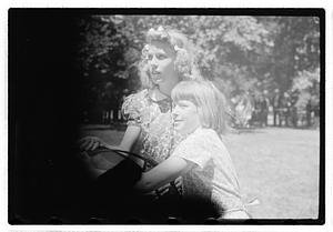 Two girls holding hoops