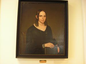 Framed portrait of woman in dark dress