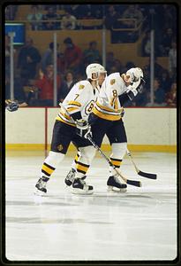Boston (circa 1986-87) # 7 Ray Bourque skates with teammate #8 Cam Neely, Boston Garden