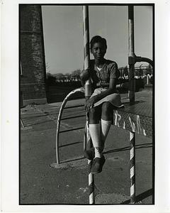 Portrait of young girl on playground equipment