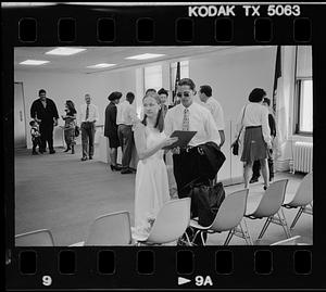 People wait at a government office, probably for civil wedding ceremonies
