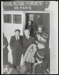 Former Nazi Envoy Questioned -- Otto Abetz (carrying coat), former German ambassador to occupied France, leaves Second Military Tribunal headquarters at Remilly, a Paris suburb, after being questioned by French authorities. Abetz is being held for trial as a war criminal.
