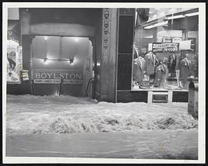 Downtown Flood-Water pours into the Boylston St. subway station of the MTA after a main broke at Washington and Boylston Sts. Pedestrian and automobile traffic was rerouted, but subway service was not affected by the break which turned lower Washington St. into a river.