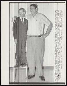 Lubbock, Tex: 6-8, 385-lb Max Palmer is still several inches taller than the Rev. Dick Cunningham, pastor of the Southwest Baptist Church of Wichita Falls, Tex., even when Cunningham stands on a chair. The tallest man in America, Palmer now has turned to evangelism.