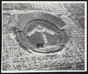 Baltimore Municipal Stadium, where the annual major league All-Star game will be played tomorrow. Originally built for football, the Stadium has been revised, by a fence, to meet baseball requirements. This aerial view shows the Stadium, with special diagramming to indicate the length of the foul lines. Right-handed batters get a break in this park.