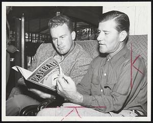 Game finds Catcher Hollis Sheely and Coach Luman Harris magazine of their craft at Hotel Kenmore. Later they and team Sox in night contest at Fenway Park.