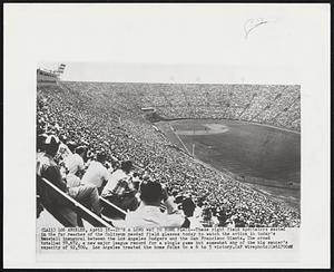 It's a Long Way to Home Plate--These right field spectators seated in the far reaches of the Coliseum needed field glasses today to watch the action in today's baseball inaugural between the Los Angeles Dodgers and the San Francisco Giants. The crows totalled 78,672, a new major league record for a single game but somewhat shy of the big saucer's capacity of 92,500. Los Angeles treated the home folks to a 6 to 5 victory.