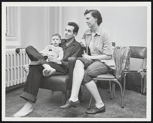 Evacuees at Fort Banks. John J. Couch holding son Jeffrey 14 mos. & wife Ruby.