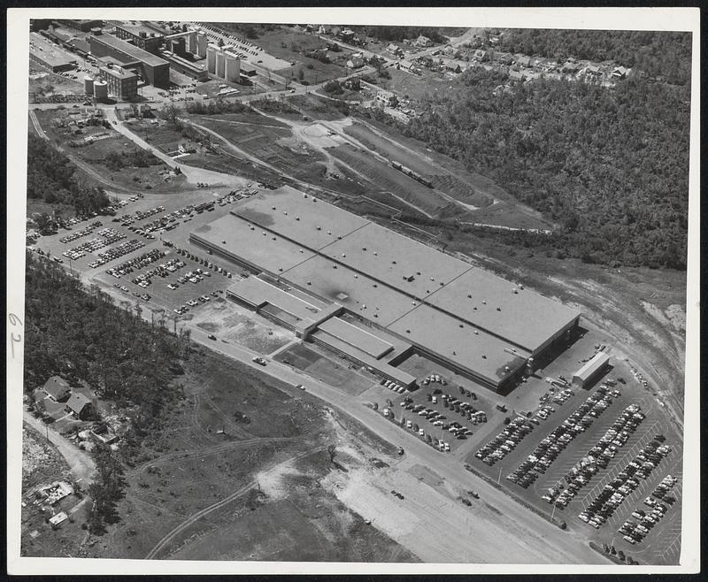 Shattered Factory Repaired--This Big Norton Company Factory in the Greendale Section of Worcester Was a Mass of Wreckage When the Tornado Passed. Now as Shown Here it is a Once Again a Busy Industrial Plant, Repairs Made and Utility Restored. It is Near Badly Battered Assumption College.