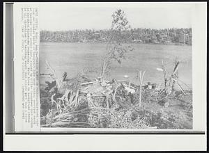 Outing, Minn. – Tornado Havoc In Forest – Shattered cottage and sunken boats at Roosevelt Lake near Outing overlook swath of twisted trees across lake, cause by killer tornadoes that struck in northern Minnesota Wednesday. Note tree in background strewn in all directions by twisting winds that killed more than a dozen persons.