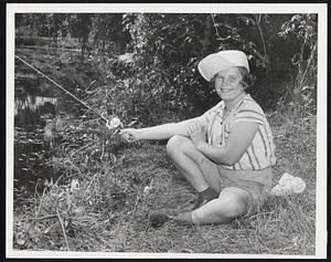 Look, Ma, One Hand - Jaunty fisher-gal Helen Murray, 11, demonstrates technique in the annual town of Brookline fishing derby, held yesterday at Larz Anderson Pond.