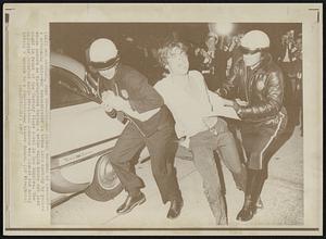 Anti-War Picket Becomes an Objector -- A screaming anti-war demonstrator is taken into custody by police whose orders he disregarded during a melee which broke out last night in front of the Century Plaza hotel in Los Angeles. The disorder occurred while President Johnson was inside the hotel giving a speech to a fund-raising dinner dance.